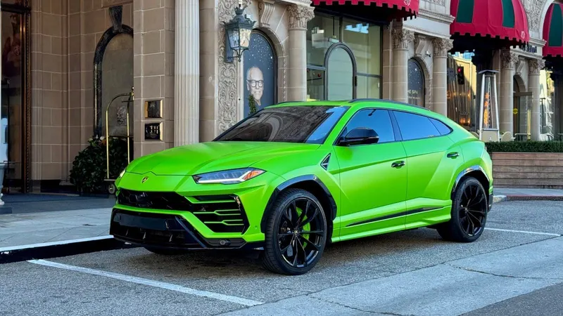 Green 2021 Lamborghini Urus, front three-quarter view