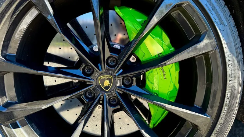 Wheel and green brake caliper